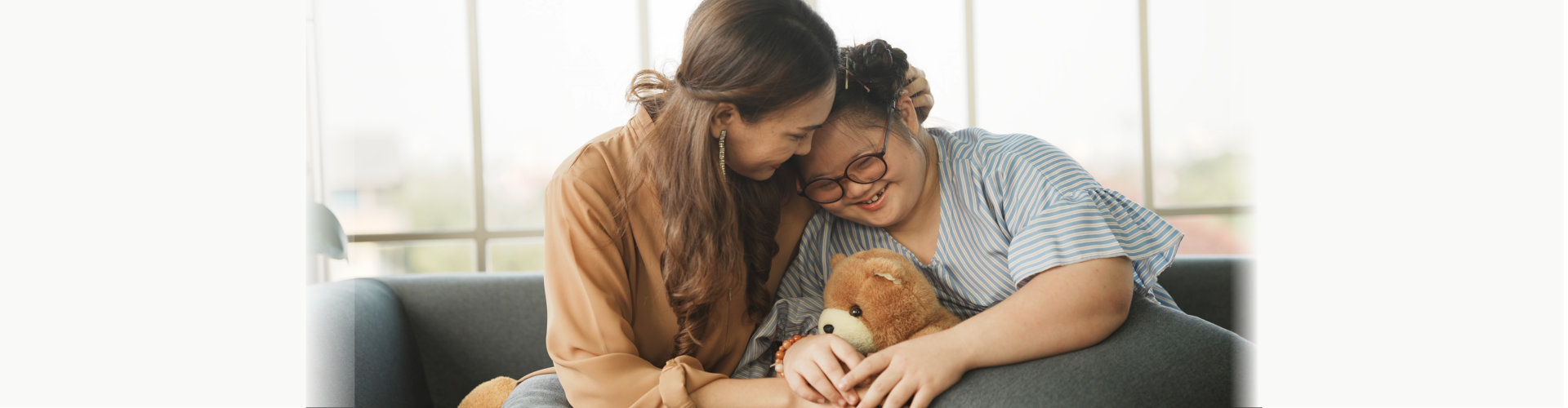 image of a child with special needs and a woman