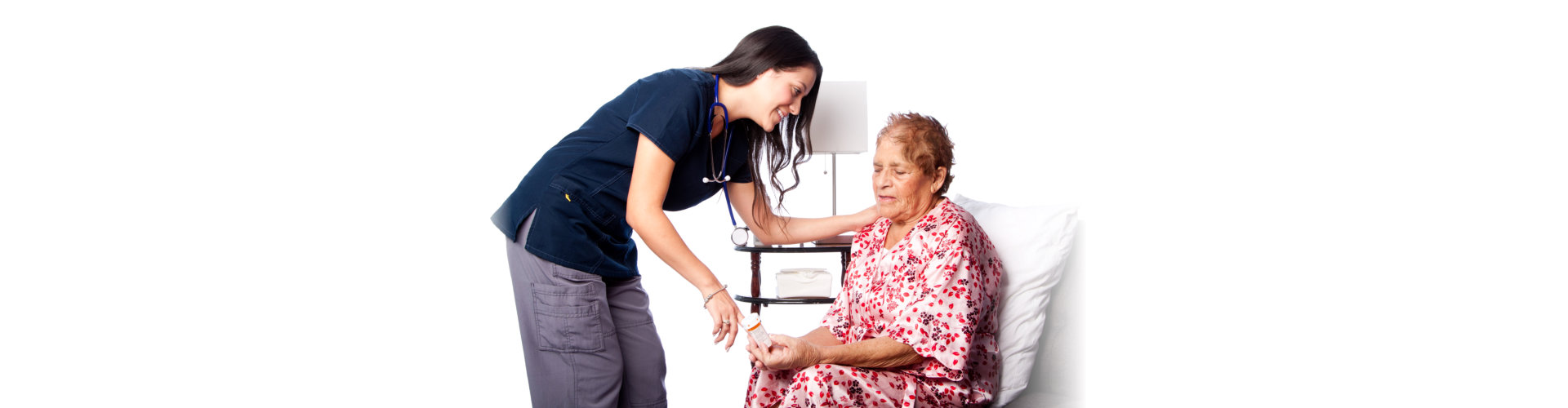 nurse explaining prescription medication to senior patient
